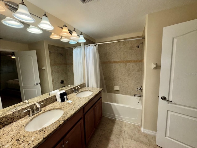 bathroom featuring vanity, tile patterned floors, a textured ceiling, and shower / bath combo with shower curtain