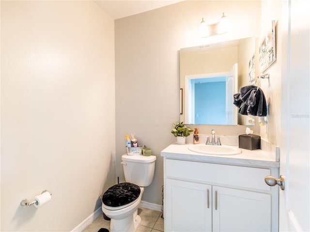 bathroom with tile patterned floors, vanity, and toilet