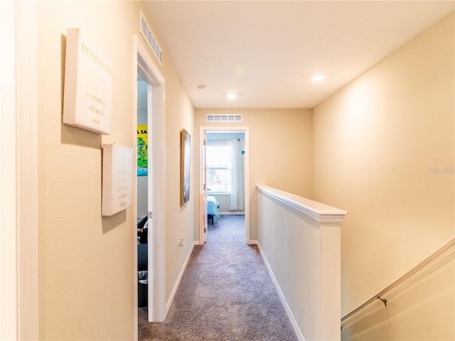 corridor featuring carpet floors