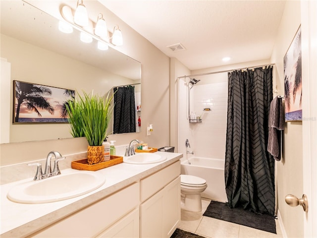 full bathroom with vanity, toilet, tile patterned floors, and shower / bath combo with shower curtain