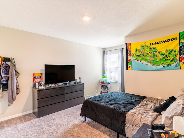 carpeted bedroom featuring a textured ceiling