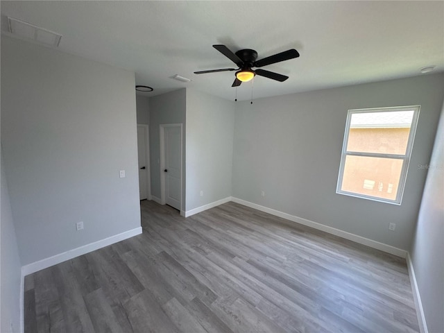 104 Australian Dr, Rotonda West, FL 33947 - spare room with wood finished floors and ceiling fan