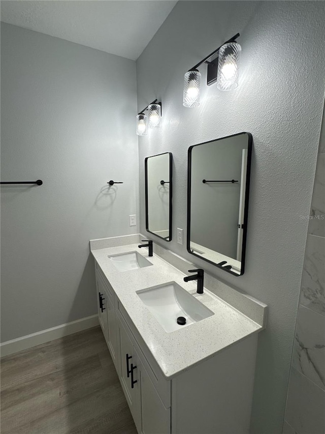104 Australian Dr, Rotonda West, FL 33947 - full bath with double vanity and wood finished floors