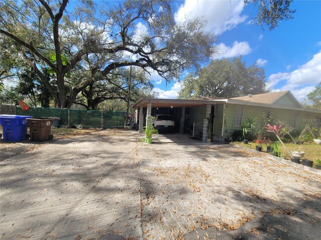 view of property exterior featuring a carport