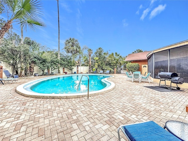 view of swimming pool featuring a patio