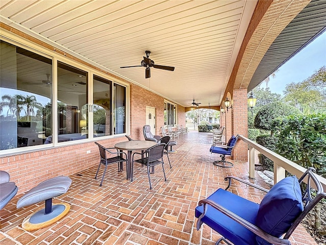 view of patio featuring ceiling fan