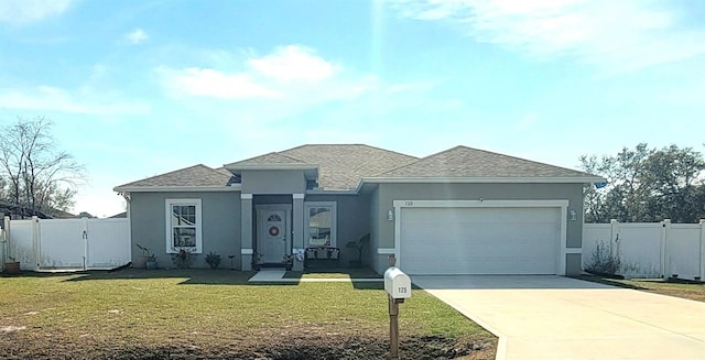 view of front facade featuring a garage and a front lawn