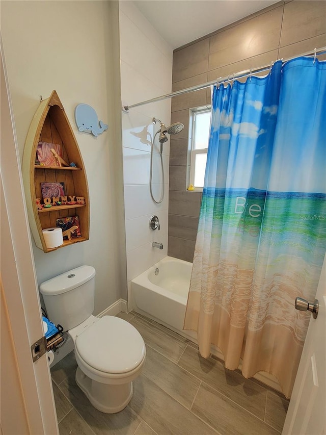 bathroom with shower / bath combo and toilet