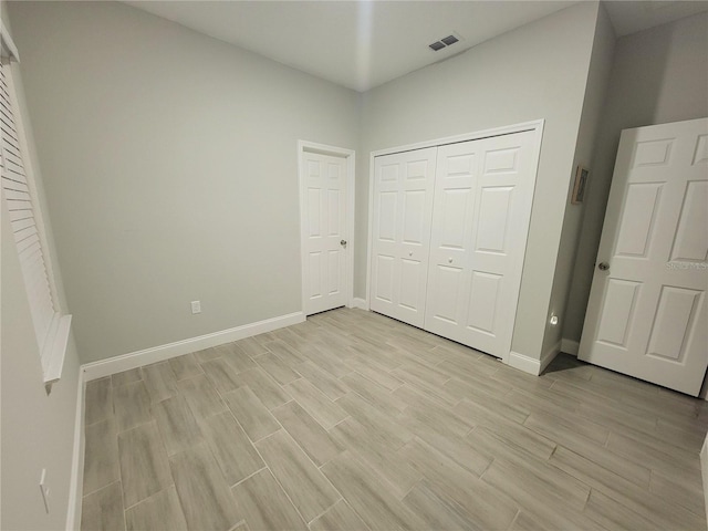 unfurnished bedroom with a closet