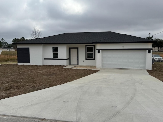 ranch-style home featuring a garage