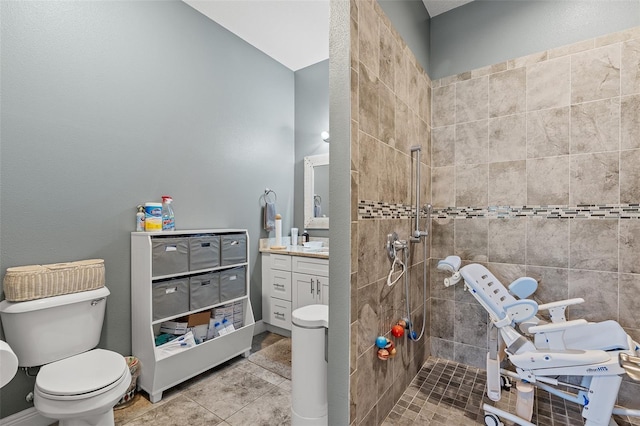 full bathroom with toilet, vanity, walk in shower, baseboards, and tile patterned floors