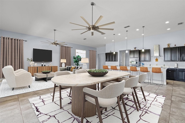 dining area with a ceiling fan, recessed lighting, visible vents, and light tile patterned floors