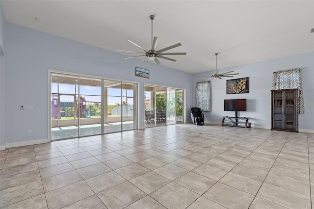 unfurnished living room featuring light tile patterned floors, baseboards, and a ceiling fan