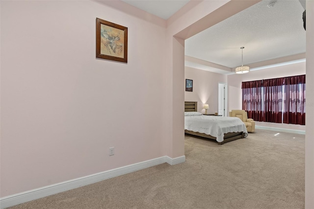 unfurnished bedroom with carpet and baseboards