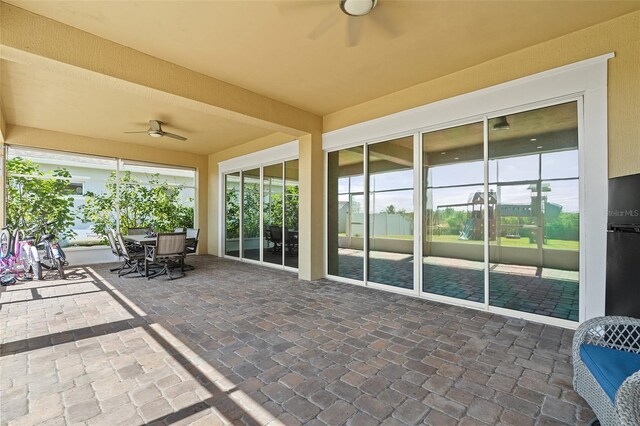 view of patio / terrace featuring ceiling fan and outdoor dining area