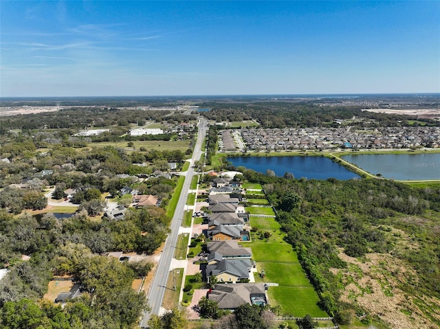 bird's eye view featuring a water view and a residential view