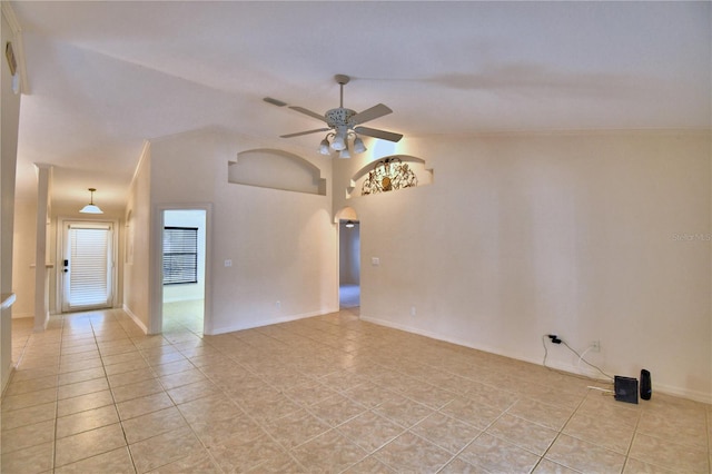 unfurnished room featuring lofted ceiling, light tile patterned floors, and ceiling fan