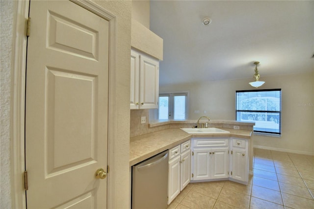 kitchen with decorative light fixtures, dishwasher, sink, white cabinets, and kitchen peninsula