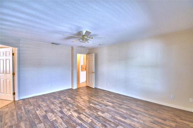 spare room featuring crown molding, ceiling fan, dark hardwood / wood-style flooring, and a textured ceiling