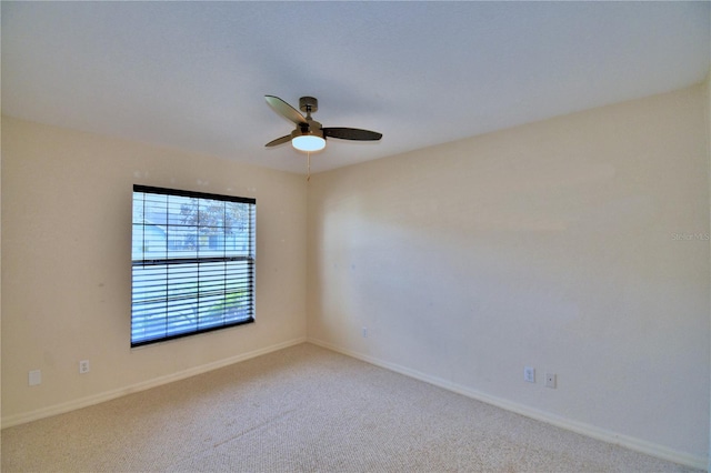 carpeted empty room with ceiling fan