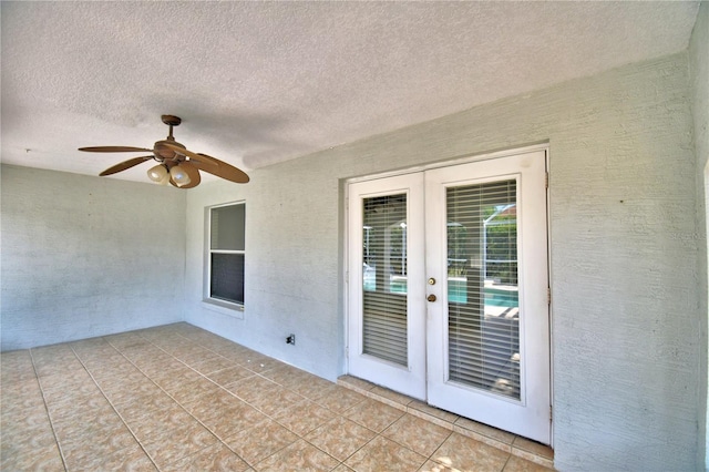 view of patio with french doors and ceiling fan