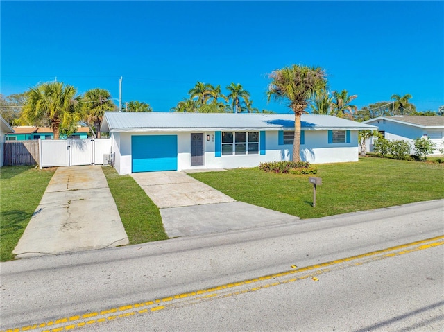 single story home with a garage and a front yard