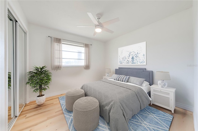 bedroom featuring hardwood / wood-style flooring, a closet, and ceiling fan