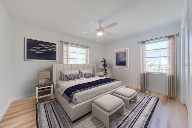 bedroom featuring ceiling fan and light hardwood / wood-style floors