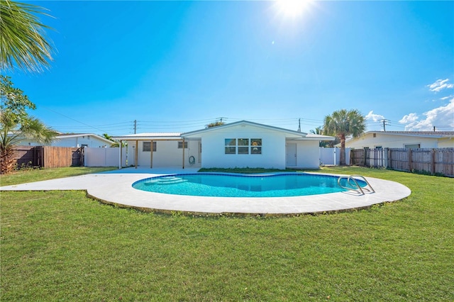 view of pool featuring a patio and a lawn