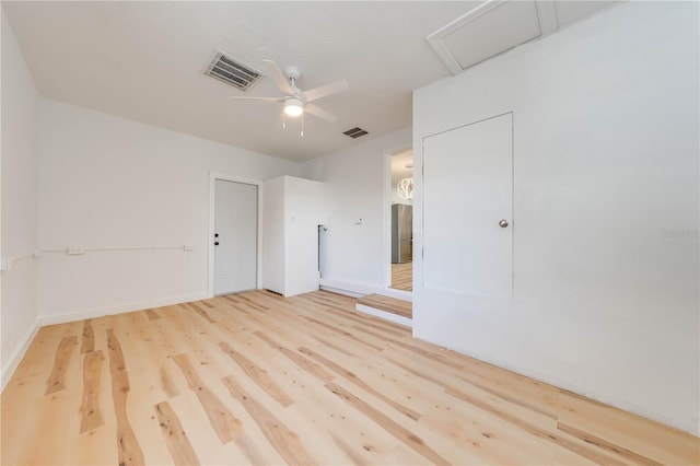 unfurnished room featuring ceiling fan and hardwood / wood-style floors