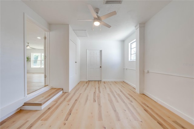 unfurnished room featuring ceiling fan and light hardwood / wood-style floors