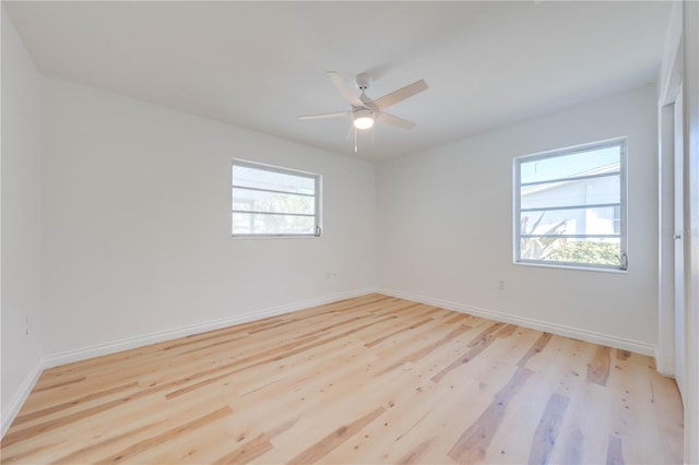 unfurnished room featuring ceiling fan and light wood-type flooring