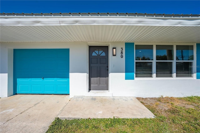 entrance to property featuring a garage