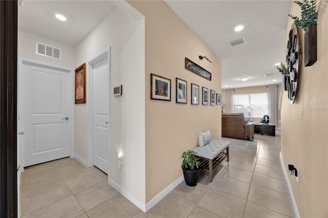 hallway with light tile patterned flooring