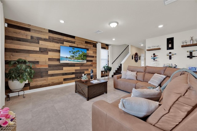 living room with wooden walls