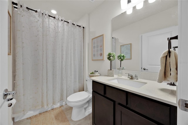 bathroom with tile patterned floors, vanity, and toilet