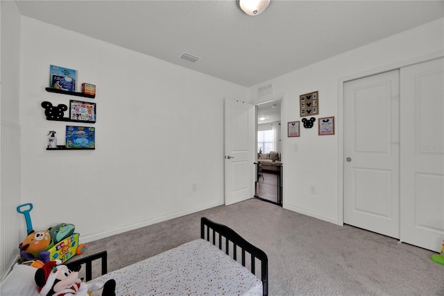 bedroom with light carpet