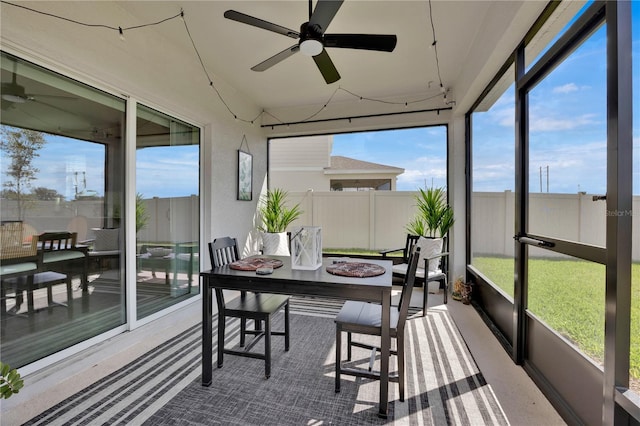 sunroom featuring ceiling fan