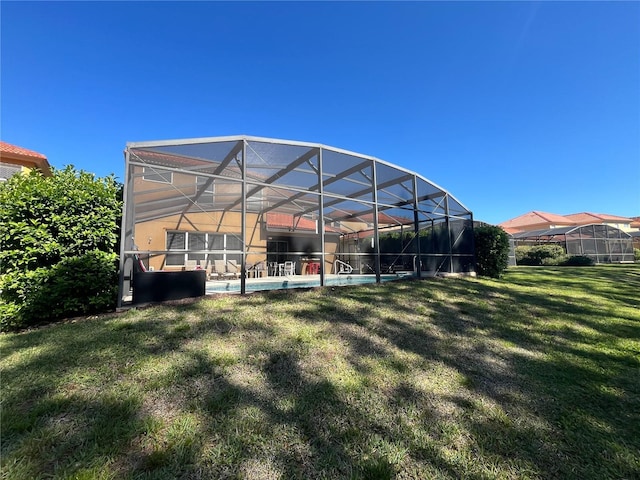 exterior space featuring a lanai and an outdoor pool