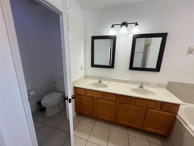 bathroom with visible vents, a sink, toilet, and tile patterned floors