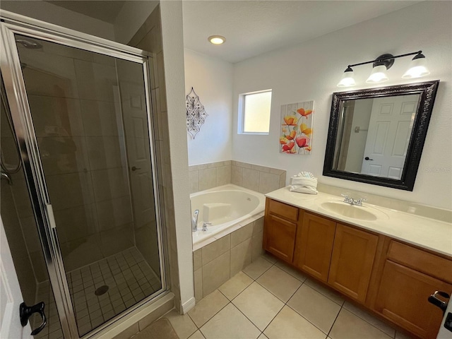 full bath featuring tile patterned flooring, a garden tub, a shower stall, and vanity