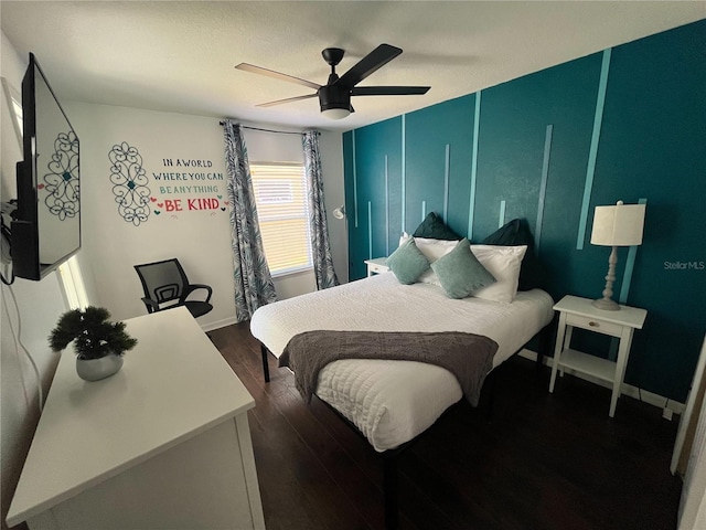 bedroom featuring dark wood-style floors, baseboards, and a ceiling fan