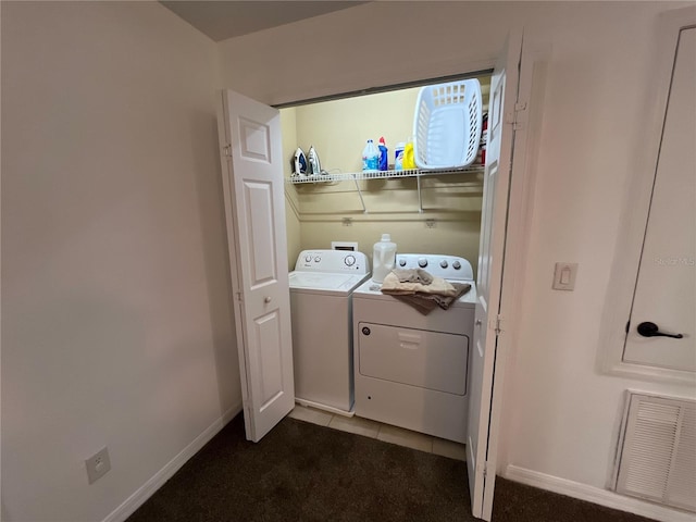 laundry room featuring laundry area, visible vents, baseboards, tile patterned floors, and washing machine and dryer