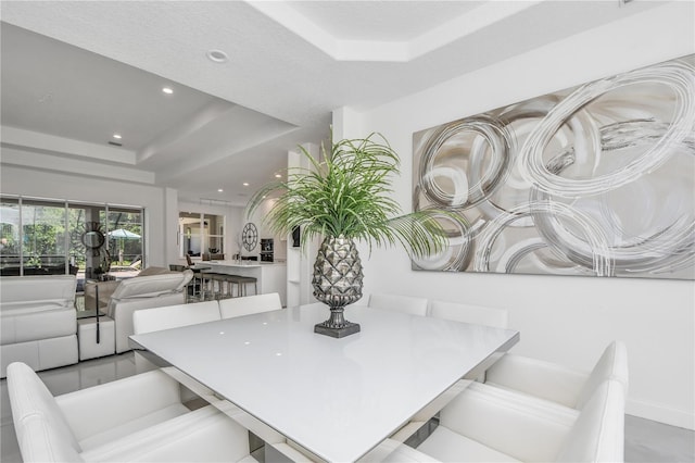 dining area featuring a tray ceiling