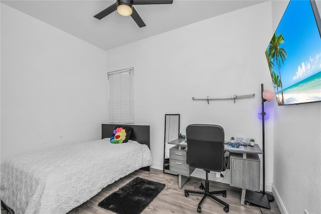 bedroom featuring hardwood / wood-style floors and ceiling fan