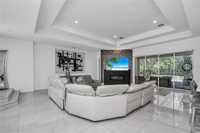 living room featuring a tray ceiling