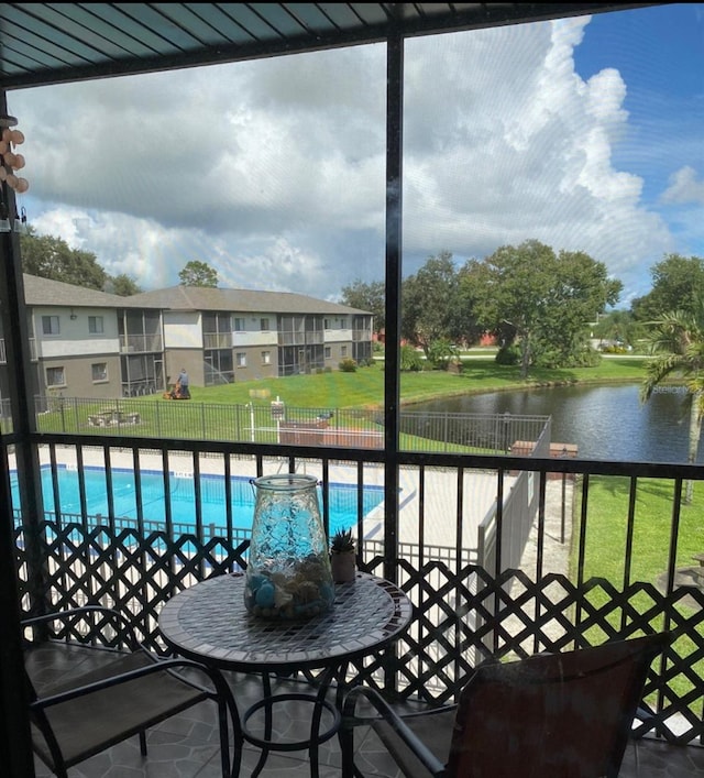 balcony featuring a water view