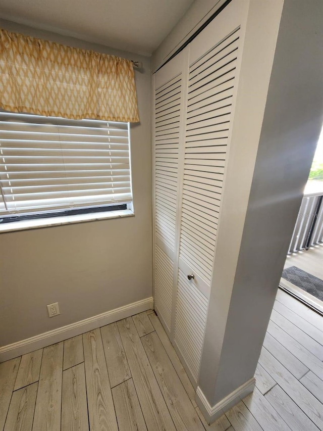 1804 University Ln Unit 308, Cocoa, FL 32922 - unfurnished bedroom featuring a closet, light wood-style flooring, and baseboards