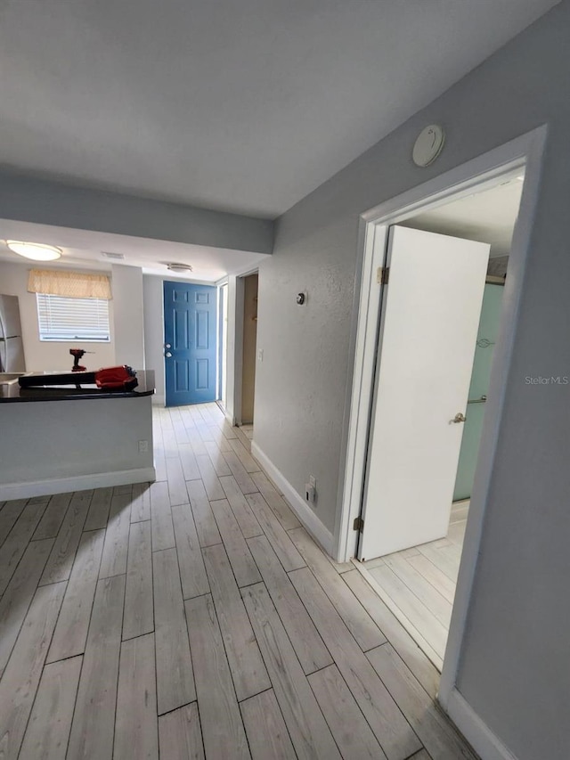 1804 University Ln Unit 308, Cocoa, FL 32922 - corridor with light wood-type flooring and baseboards