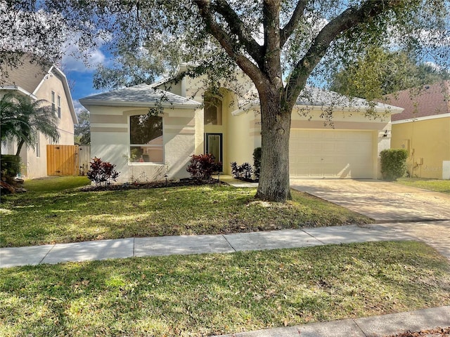 view of front of property featuring a garage and a front yard